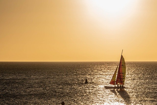 Free download sunset boat sea sailboat outdoors free picture to be edited with GIMP free online image editor