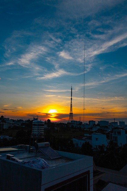 Baixe gratuitamente a imagem gratuita dos edifícios da cidade do pôr do sol, torre urbana, para ser editada com o editor de imagens on-line gratuito do GIMP
