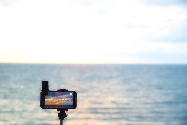 Descargue gratis la imagen gratuita de la cámara del teléfono móvil del mar del atardecer para editar con el editor de imágenes en línea gratuito GIMP