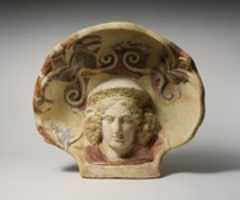 Free download Terracotta antefix (roof tile) with head of a maenad free photo or picture to be edited with GIMP online image editor