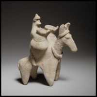 Free download Terracotta statuette of a man riding a donkey free photo or picture to be edited with GIMP online image editor