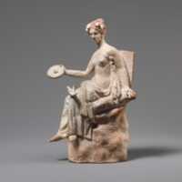 Free download Terracotta statuette of Aphrodite seated on a rock free photo or picture to be edited with GIMP online image editor
