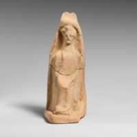 Free download Terracotta statuette of a seated female figure free photo or picture to be edited with GIMP online image editor