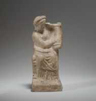 Free download Terracotta statuette of a seated woman playing a kithera free photo or picture to be edited with GIMP online image editor
