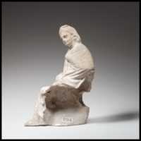Free download Terracotta statuette of a seated youth free photo or picture to be edited with GIMP online image editor