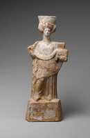 Free download Terracotta statuette of a standing woman with a basket and wreath free photo or picture to be edited with GIMP online image editor