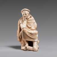 Free download Terracotta statuette of a youth seated on a rock free photo or picture to be edited with GIMP online image editor