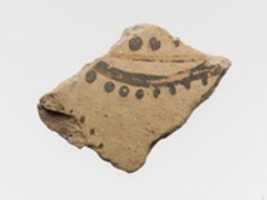 Free download Terracotta vessel fragment with floral or marine motif free photo or picture to be edited with GIMP online image editor