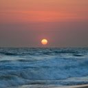 the sun setting over the ocean with gentle waves  screen for extension Chrome web store in OffiDocs Chromium