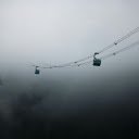 Two cable cars are suspended in the fog  screen for extension Chrome web store in OffiDocs Chromium