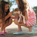 Two girls holding dogs  screen for extension Chrome web store in OffiDocs Chromium