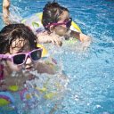 Two little children swimming  screen for extension Chrome web store in OffiDocs Chromium