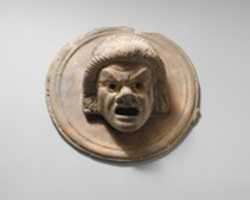 Free download Two terracotta roundels with theatrical masks free photo or picture to be edited with GIMP online image editor