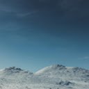Winter Peaks Under Clear Skies  screen for extension Chrome web store in OffiDocs Chromium