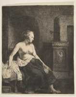 Free download Woman Sitting Half-Dressed beside a Stove free photo or picture to be edited with GIMP online image editor