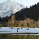 Woman Walking on a Pier on a Lake in a Valley  screen for extension Chrome web store in OffiDocs Chromium
