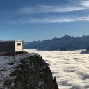 Wooden Shed over Cloud under Mountains Peaks  screen for extension Chrome web store in OffiDocs Chromium