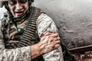 Free download wounded-in-shoulder-soldier-trying-stop-bleeding-PG9E0D free photo or picture to be edited with GIMP online image editor