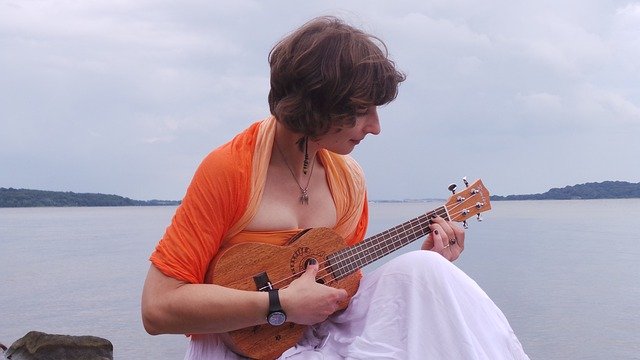 Free download Young Woman Playing The Ukulele -  free photo or picture to be edited with GIMP online image editor