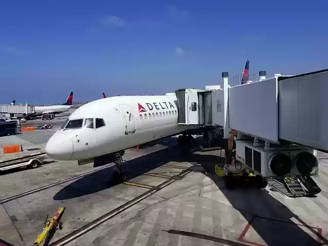 Free download Airplane Jetbridge Delta -  free free photo or picture to be edited with GIMP online image editor