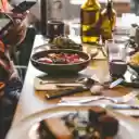 A Person Taking a Picture of Food on a Dining Table  screen for extension Chrome web store in OffiDocs Chromium