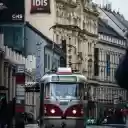A red and white tram on a city street  screen for extension Chrome web store in OffiDocs Chromium