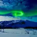 Aurora Borealis over Snowy Landscape  screen for extension Chrome web store in OffiDocs Chromium