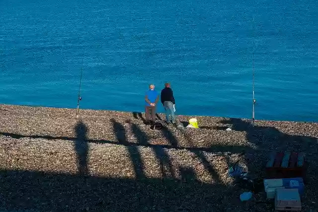 Free download Beach Sea Fisherman -  free photo or picture to be edited with GIMP online image editor