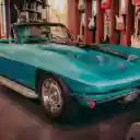 Blue Chevrolet Car Parked Inside the Guitar Store  screen for extension Chrome web store in OffiDocs Chromium