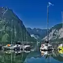Boats on the mountain lake  screen for extension Chrome web store in OffiDocs Chromium