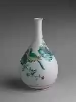 Free download Bottle with Rock, Flowers, and Birds free photo or picture to be edited with GIMP online image editor