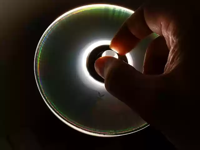 Free download cd dvd data data store hand grasp free picture to be edited with GIMP free online image editor