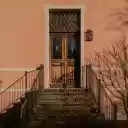 Charming Pink Facade with Rustic Wooden Door  screen for extension Chrome web store in OffiDocs Chromium