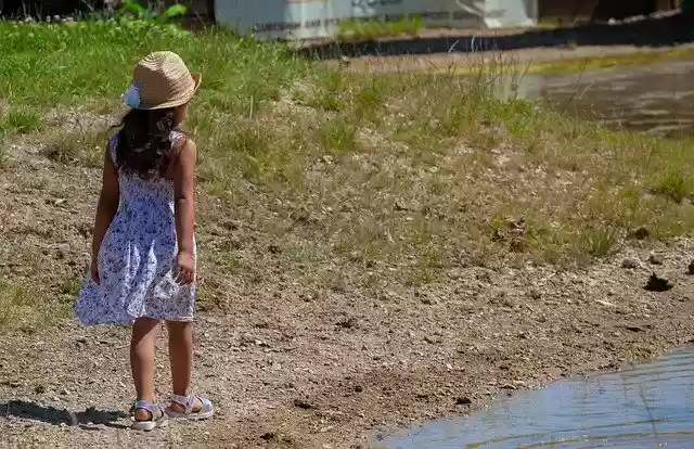Free download Child On Pond Shore In Hat -  free photo or picture to be edited with GIMP online image editor
