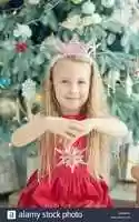 Free download cute-blonde-girl-5-years-old-with-christmas-star-decoration-near-christmas-tree-happy-new-year-2020-concept-2A846GX free photo or picture to be edited with GIMP online image editor