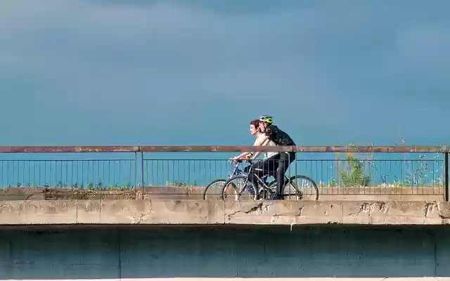 Free download cyclists people male going bicycle free picture to be edited with GIMP free online image editor