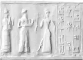 Free download Cylinder seal and modern impression: suppliant goddess and offering bearer approaching Ishtar, three columns of inscription free photo or picture to be edited with GIMP online image editor