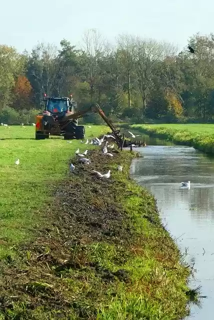 Free download Ditch Dredging Tractor -  free photo or picture to be edited with GIMP online image editor