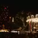 Festive Night at a Christmas Market with Illuminated Carousel  screen for extension Chrome web store in OffiDocs Chromium