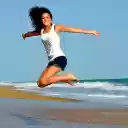 Girl jumping on the beach  screen for extension Chrome web store in OffiDocs Chromium