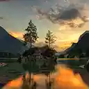 Green trees near lake with cloudy sky during daytime  screen for extension Chrome web store in OffiDocs Chromium