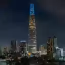 Illuminated Skyscraper Dominating the Night Skyline  screen for extension Chrome web store in OffiDocs Chromium