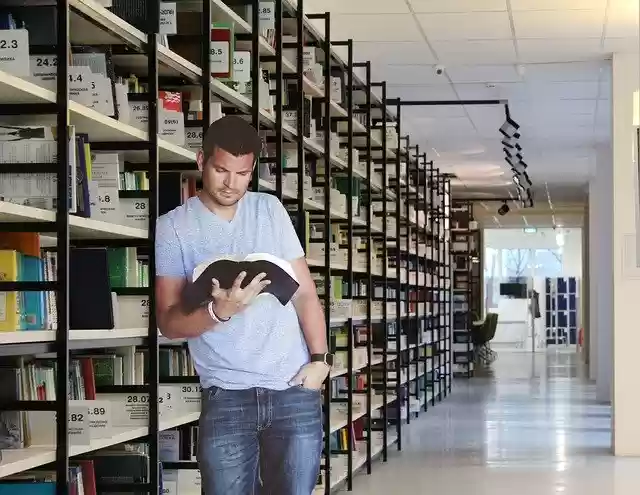 Free download Man Reading Library -  free photo or picture to be edited with GIMP online image editor