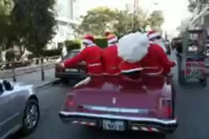 Free download Men dressed as a Santa Claus parade on a old car on the last day of 2017 in Gaza city, Palestine, Dec. 31, 2017.Photos by Mohammed Zaanoun free photo or picture to be edited with GIMP online image editor