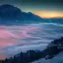 Mystical Fog Over Snowy Mountains at Sunset  screen for extension Chrome web store in OffiDocs Chromium