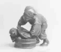 Free download Netsuke of Man Forcing Monkey into a Basket free photo or picture to be edited with GIMP online image editor