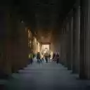 People walking through a long hallway with columns  screen for extension Chrome web store in OffiDocs Chromium