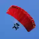 Red parachute in the blue sky.  screen for extension Chrome web store in OffiDocs Chromium
