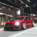 Red Subaru Parked in Front of Building  screen for extension Chrome web store in OffiDocs Chromium