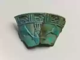Free download Relief chalice rim fragment with a wedjat frieze and below that a Hathor sistrum head emerging from papyrus plants free photo or picture to be edited with GIMP online image editor